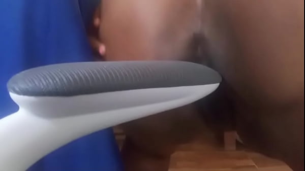 Naughty believer with tension puts the arm of the chair in her pussy